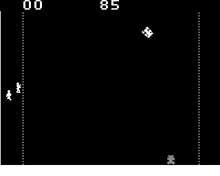 Death Race in play on the black-and-white monitor: score 00 at the top left and the timer at 85 in the centre, dashed vertical walls down each side above a solid white kerb, player one's car banked over at the top right, two gremlins fleeing along the left wall, and player two's parked car in the grey the board's own resistor network draws it in